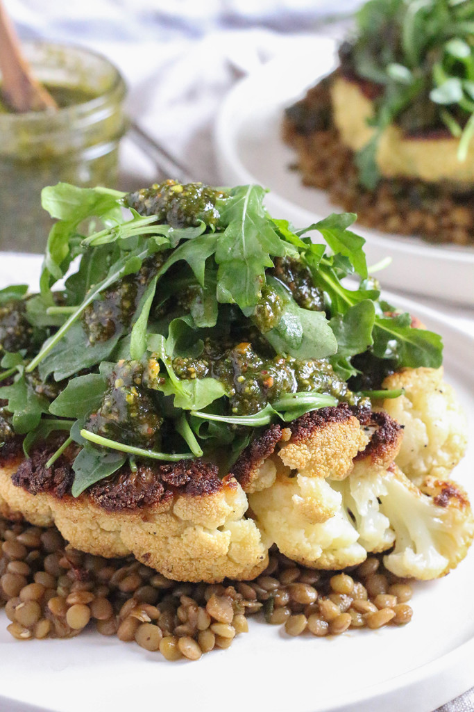 Cauliflower Steaks with herbed lentils, arugula, and roasted pistachio mint pesto |The Mostly Vegan