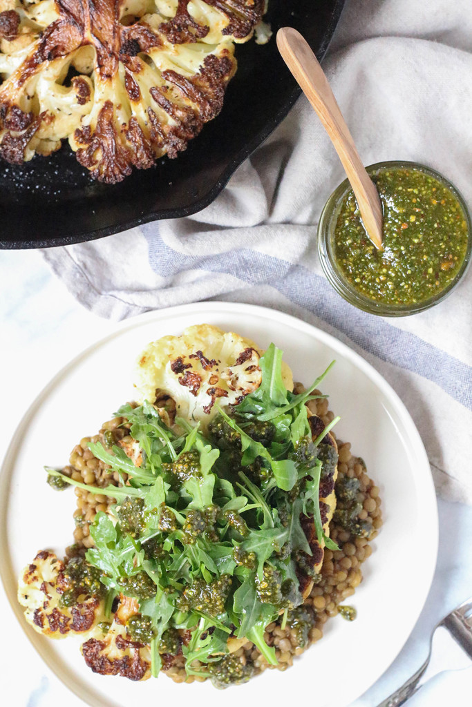 Cauliflower Steaks with herbed lentils, arugula, and roasted pistachio mint pesto |The Mostly Vegan