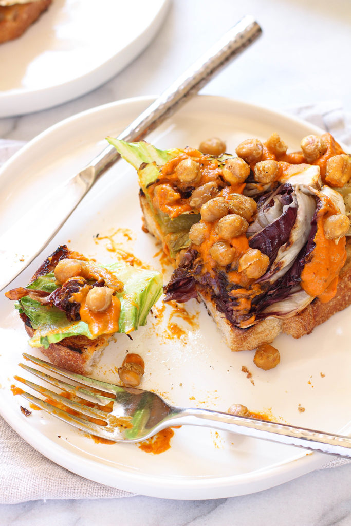 Grilled romaine & radicchio salad on sourdough with charred carrot dressing and crispy cumin spiced chickpeas