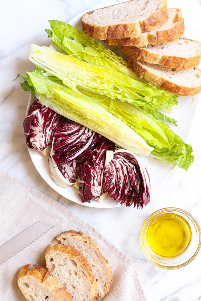 Grilled romaine & radicchio salad on sourdough with charred carrot dressing and crispy cumin spiced chickpeas