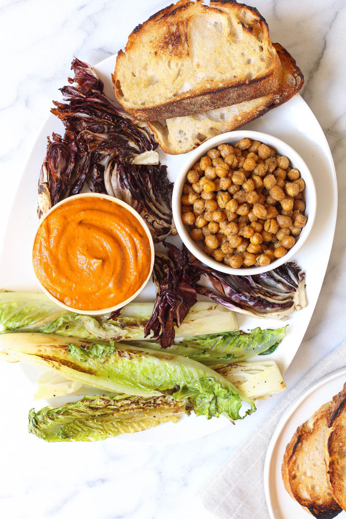 Grilled romaine & radicchio salad on sourdough with charred carrot dressing and crispy cumin spiced chickpeas