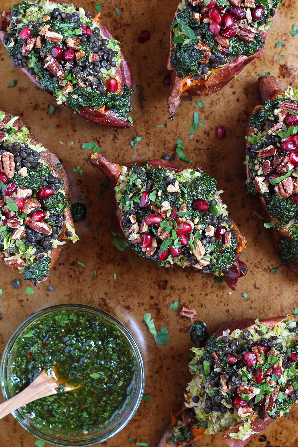 Roasted sweet potatoes with pomegranate chimichurri, shredded brussels sprouts, and black lentils - vegan & gluten free